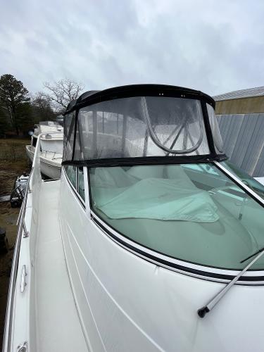 Slide: The Image of 2006 Carver 36 Mariner boat with enclosed cockpit on a cloudy day. - 6
