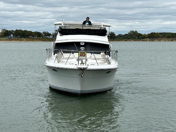 Slide: The Image of 1992 Carver 38 Aft Cabin yacht for sale on calm water. - 4