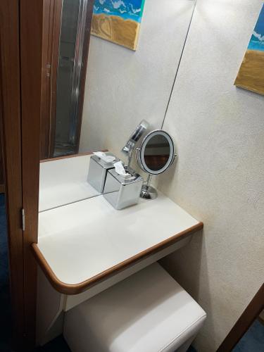 Slide: The Image of Vanity area in 1992 Carver 38 Aft Cabin yacht with mirror and storage. - 42
