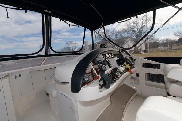 Slide: The Image of 2006 Carver 38 Super Sport boat helm with modern controls and panoramic windows. - 10