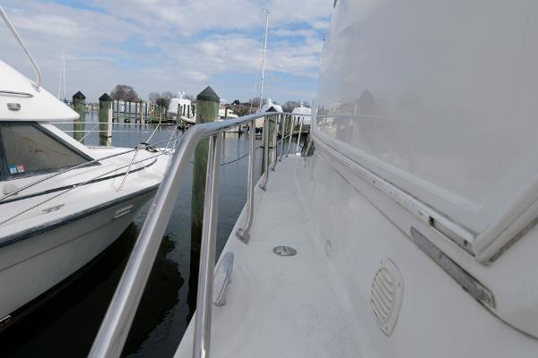 Slide: The Image of 2006 Carver 38 Super Sport yacht docked at marina, side deck view. - 11