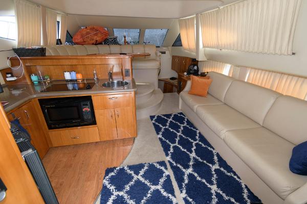 Slide: The Image of Interior of 2006 Carver 38 Super Sport yacht with kitchen and lounge area. - 12
