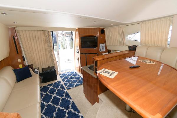 Slide: The Image of Interior of 2006 Carver 38 Super Sport yacht with modern furnishings and blue carpet. - 14