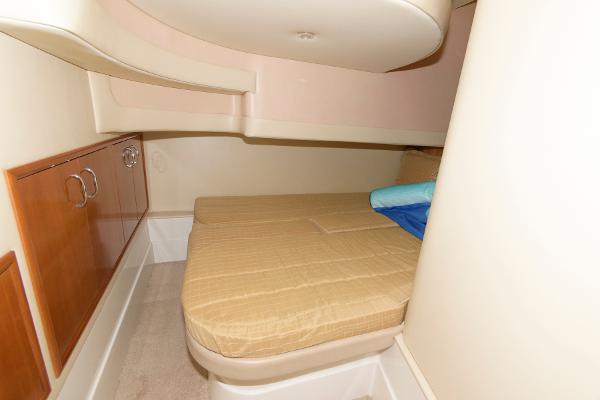 Slide: The Image of 2006 Carver 38 Super Sport cabin with bed and storage cabinets. - 18