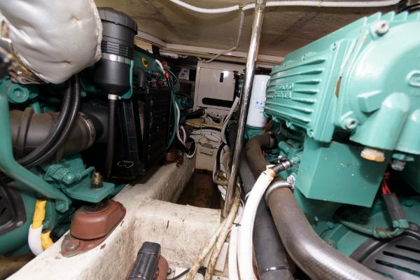 Slide: The Image of Engine room of a 2006 Carver 38 Super Sport yacht with visible machinery. - 22