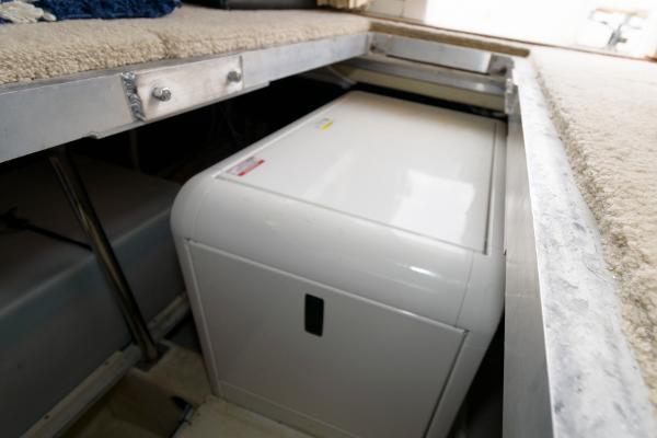 Slide: The Image of 2006 Carver 38 Super Sport engine compartment with generator. - 23