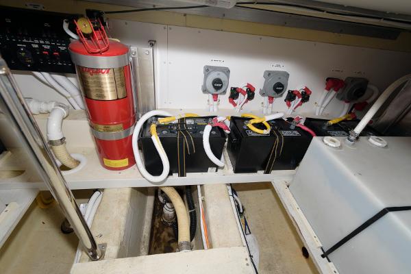 Slide: The Image of Engine room of a 2006 Carver 38 Super Sport with batteries and fire extinguisher. - 24