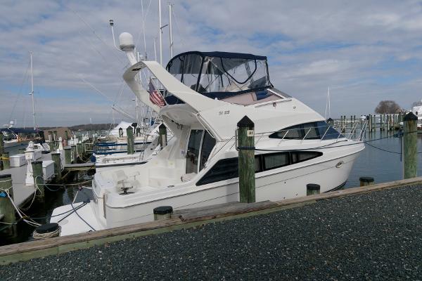 Slide: The Image of 2006 Carver 38 Super Sport yacht docked at a marina. - 3