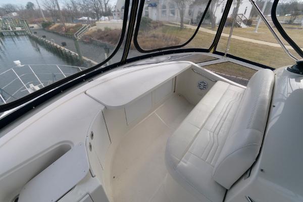 Slide: The Image of 2006 Carver 38 Super Sport boat interior with white seating and panoramic windows. - 7