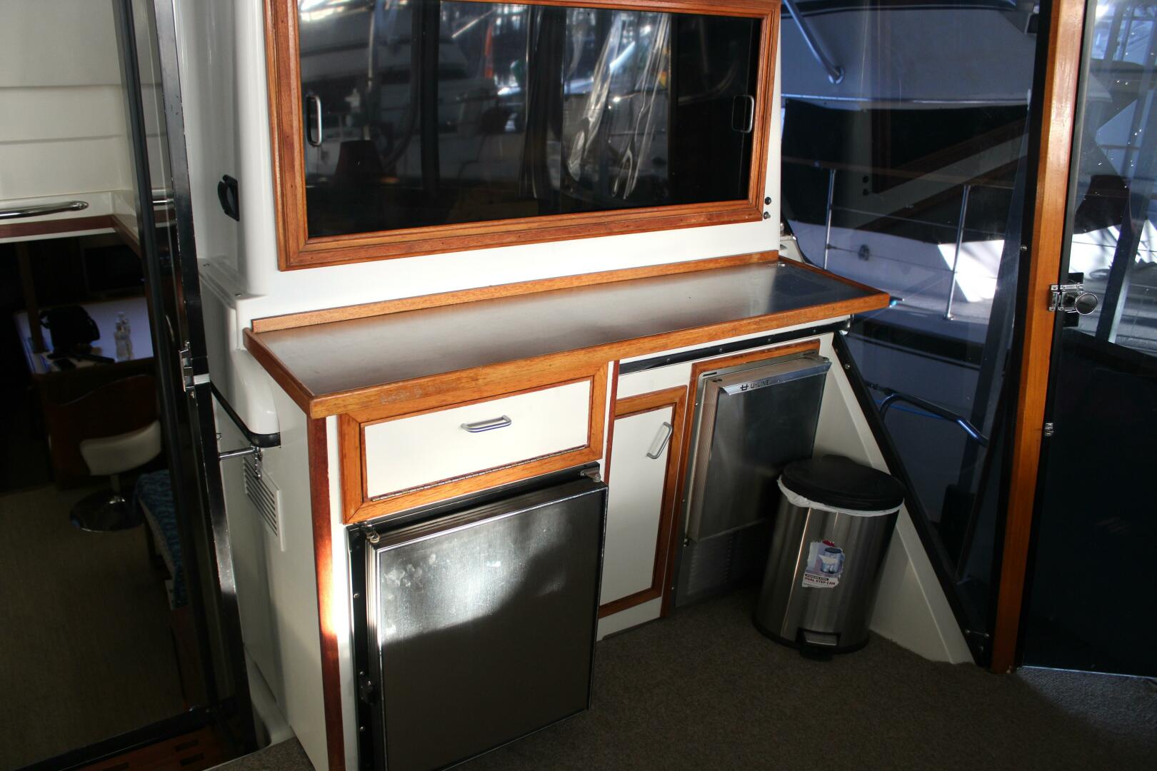 Slide: The Image of Carver 4207 - Mini Fridge and Ice Maker on Aft Deck - 5074183