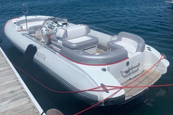 Slide: The Image of 2015 Castoldi 21 Diesel Jet Tender docked on calm water. - 1