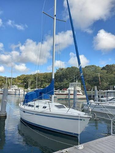 Slide: The Image of 1999 Catalina 30 MkIII sailboat docked at a marina on a sunny day. - 0