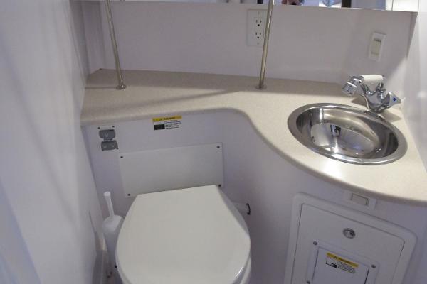 Slide: The Image of Compact bathroom in 2020 Catalina 315 with toilet, sink, and countertop. - 30