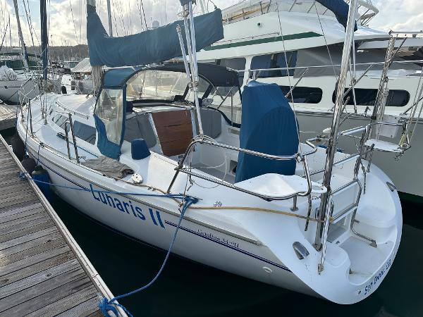 Slide: The Image of 2000 Catalina 34 MkII sailboat docked at marina, named "Lunaris II". - 1