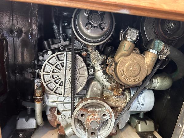 Slide: The Image of Engine compartment of a 2000 Catalina 34 MkII sailboat, showcasing mechanical components. - 22