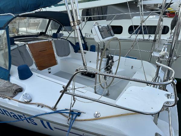 Slide: The Image of 2000 Catalina 34 MkII sailboat cockpit with steering wheel and navigation equipment. - 4