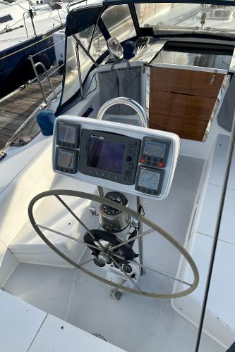 Slide: The Image of Cockpit of 2000 Catalina 34 MkII sailboat with steering wheel and navigation instruments. - 5