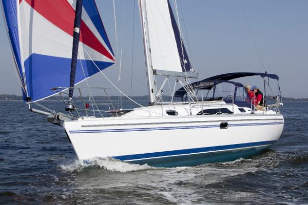 Slide: The Image of 2024 Catalina 355 sailboat cruising on open water. - 0