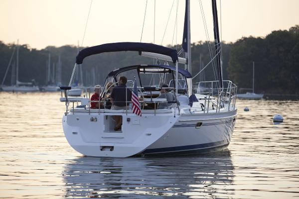 Slide: The Image of 2024 Catalina 355 sailboat cruising on a calm lake at sunset. - 10