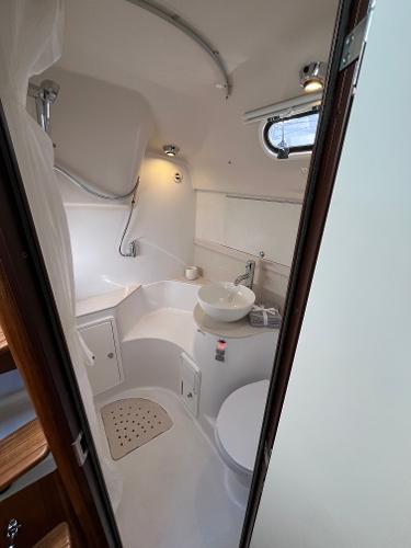 Slide: The Image of 2024 Catalina 355 yacht bathroom with modern fixtures and compact design. - 19