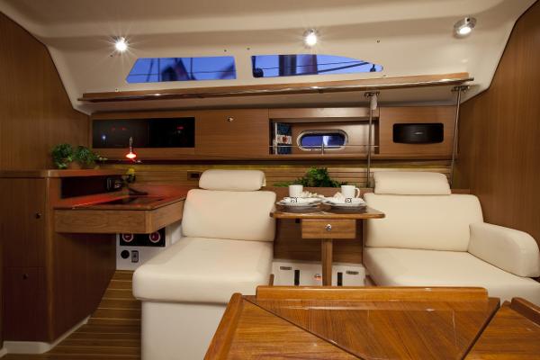 Slide: The Image of Interior of 2024 Catalina 355 sailboat with cozy seating and wooden finishes. - 6