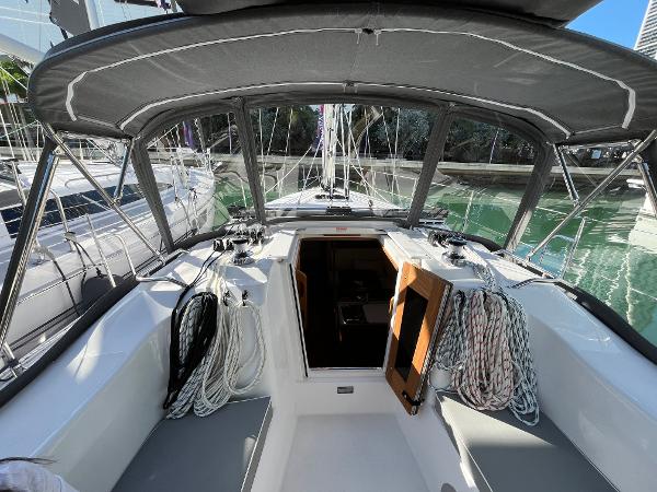 Slide: The Image of 2024 Catalina 355 sailboat cockpit with ropes and open cabin door. - 9