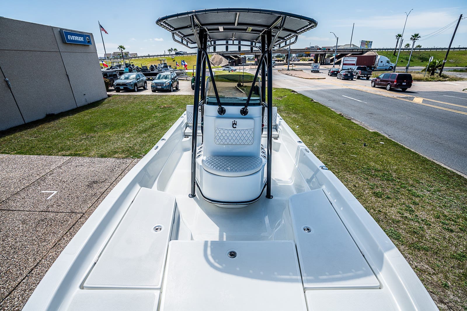 Slide: The Image of 2021 Catalyst 2300 BAY boat on display at a dealership. - 12