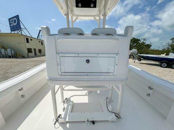 Slide: The Image of 2023 Caymas 26 HB boat interior with seating and storage compartment. - 15