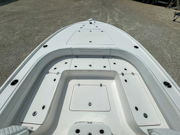 Slide: The Image of 2023 Caymas 26 HB boat deck with storage compartments. - 20
