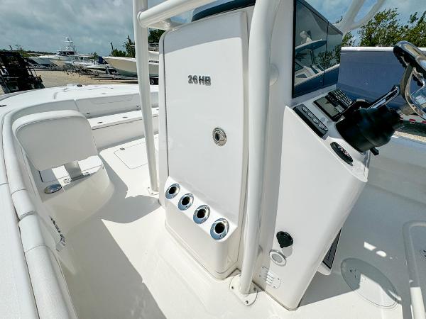 Slide: The Image of 2023 Caymas 26 HB boat interior with control panel and seating. - 23