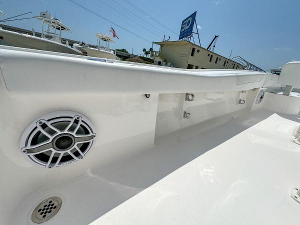 Slide: The Image of 2023 Caymas 26 HB boat interior with speaker and clean white finish. - 25