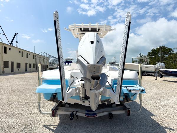 Slide: The Image of 2023 Caymas 26 HB boat rear view with dual outboard motors. - 4