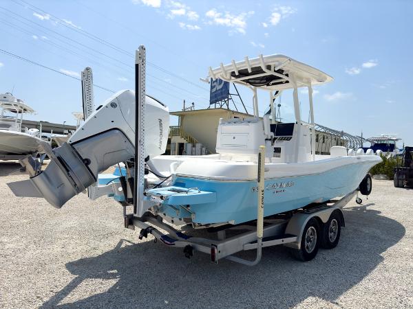 Slide: The Image of 2023 Caymas 26 HB boat on a trailer in a marina. - 5