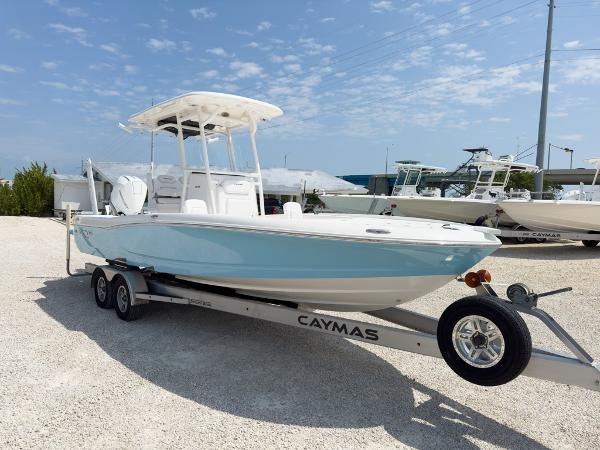 Slide: The Image of 2023 Caymas 26 HB boat on trailer in marina. - 7