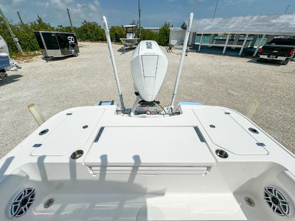 Slide: The Image of 2023 Caymas 26 HB boat with outboard motor and spacious deck. - 8