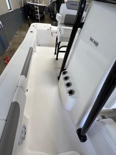 Slide: The Image of 2024 Caymas 26 Hybrid boat interior with seating and rod holders. - 11