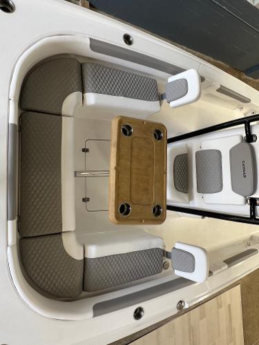Slide: The Image of 2024 Caymas 26 Hybrid boat interior with seating and table. - 13