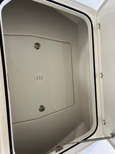 Slide: The Image of Storage compartment of 2024 Caymas 26 Hybrid boat, open and empty. - 15