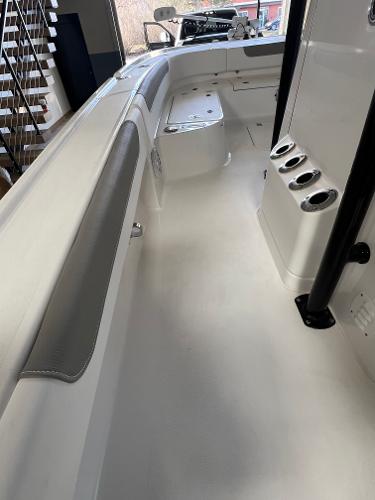 Slide: The Image of 2024 Caymas 26 Hybrid boat interior with seating and rod holders. - 19