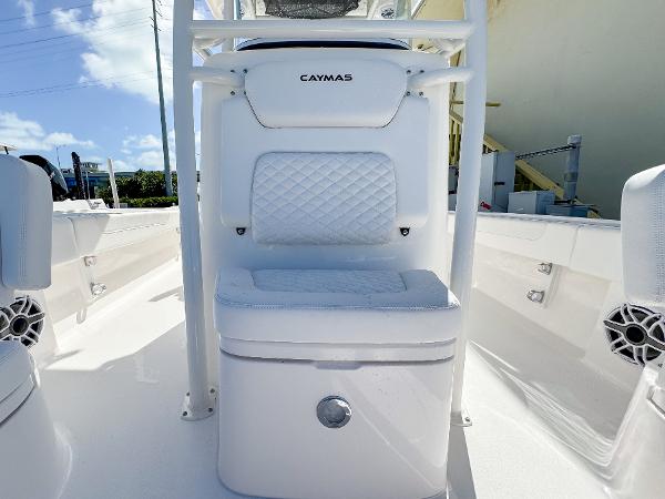 Slide: The Image of 2024 Caymas 26 HB boat interior with white cushioned seating and sleek design. - 19
