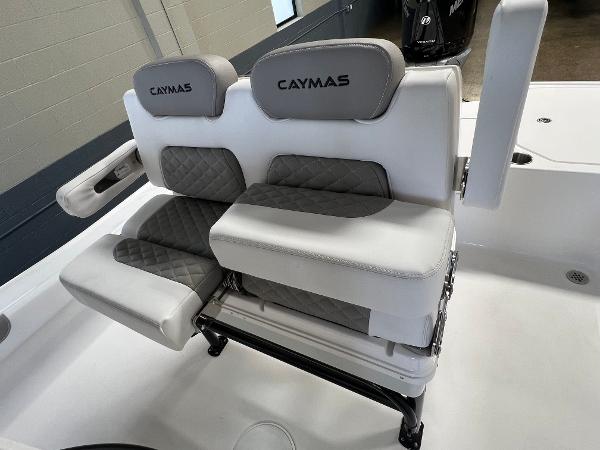 Slide: The Image of 2024 Caymas 26 Hybrid boat seating with gray and white upholstery. - 22