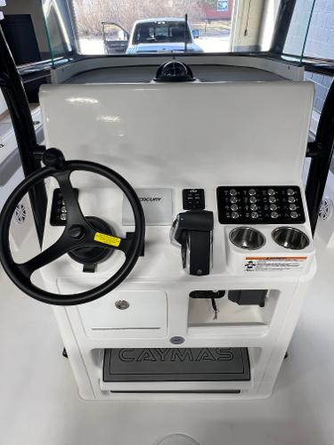 Slide: The Image of 2024 Caymas 26 Hybrid boat console with steering wheel and control panel. - 25