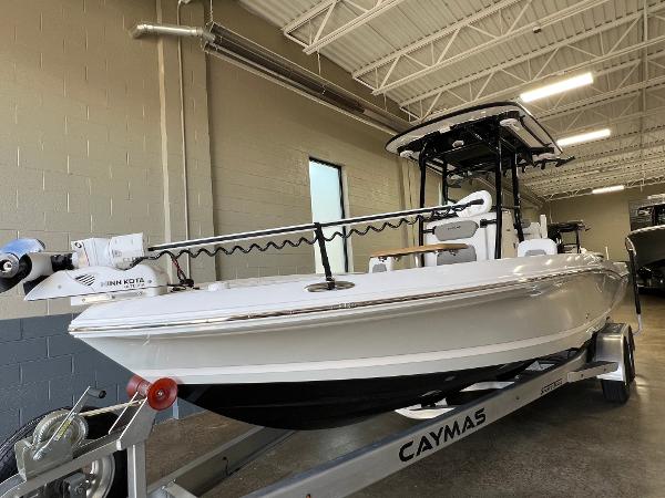 Slide: The Image of 2024 Caymas 26 Hybrid boat on trailer in indoor storage. - 28