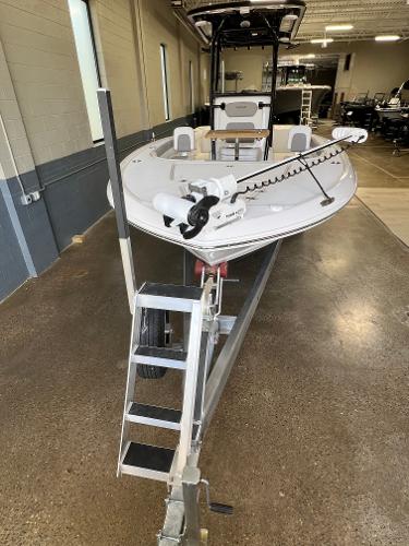 Slide: The Image of 2024 Caymas 26 Hybrid boat on a trailer in a showroom. - 3