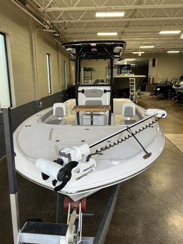 Slide: The Image of 2024 Caymas 26 Hybrid boat in showroom, front view. - 4