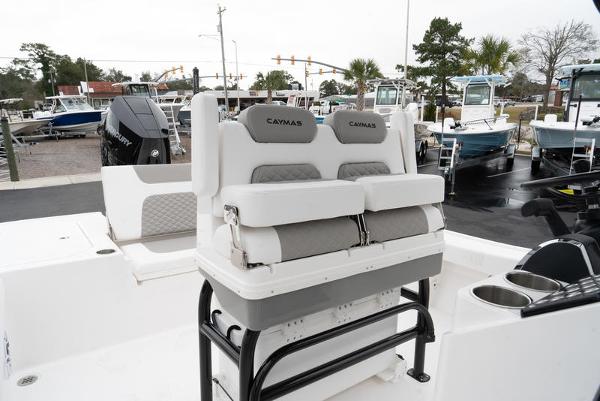 Slide: The Image of 2024 Caymas 28 HB boat with dual seats and Mercury outboard motor. - 10