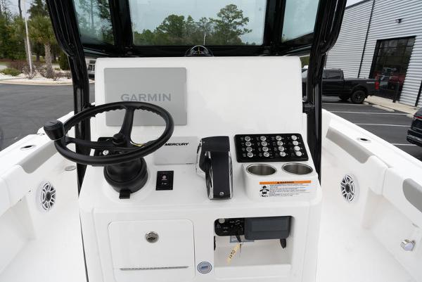 Slide: The Image of 2024 Caymas 28 HB boat console with Garmin navigation and Mercury controls. - 11