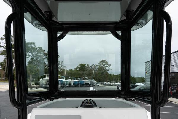 Slide: The Image of 2024 Caymas 28 HB boat console with windshield and compass. - 15