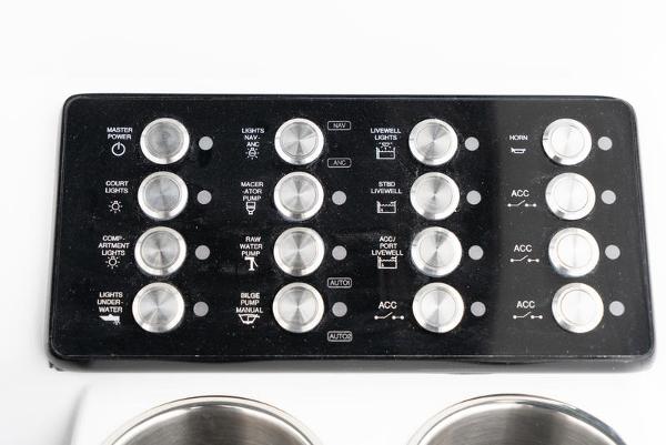Slide: The Image of Control panel of 2024 Caymas 28 HB boat with various switches and buttons. - 18