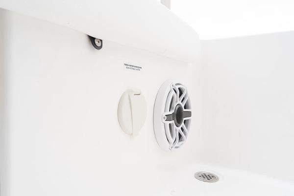 Slide: The Image of 2024 Caymas 28 HB boat interior speaker and drain detail. - 19